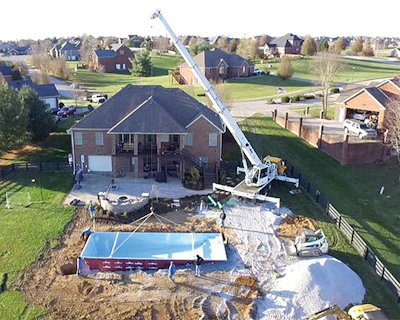 Proper handling, placement and base preparation are critical steps in fiberglass pool installation, helping builders safely navigate tight jobsite conditions while supporting the shell for long-term performance.
