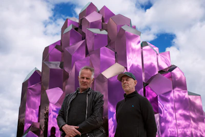 Architecture duo Bigert & Bergström stand in front of Crystal Sauna, their striking installation at WasteLand Climate Action Park in Skellefteå, Sweden.