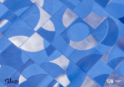 Blue and white geometric tile pattern with repeating curved segments and circular shapes in varying shades