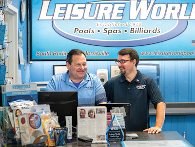 Tod Bessery, president, and Eric Bessery, field-customer care, share a laugh at the front counter.