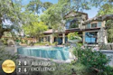 Luxury modern home with turquoise pool surrounded by mature trees and manicured landscaping, featuring 2026 Awards of Excellence gold badge