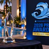 Pentair Pool 2026 Pro Awards event display with crystal award trophy and poolside venue backdrop at dusk