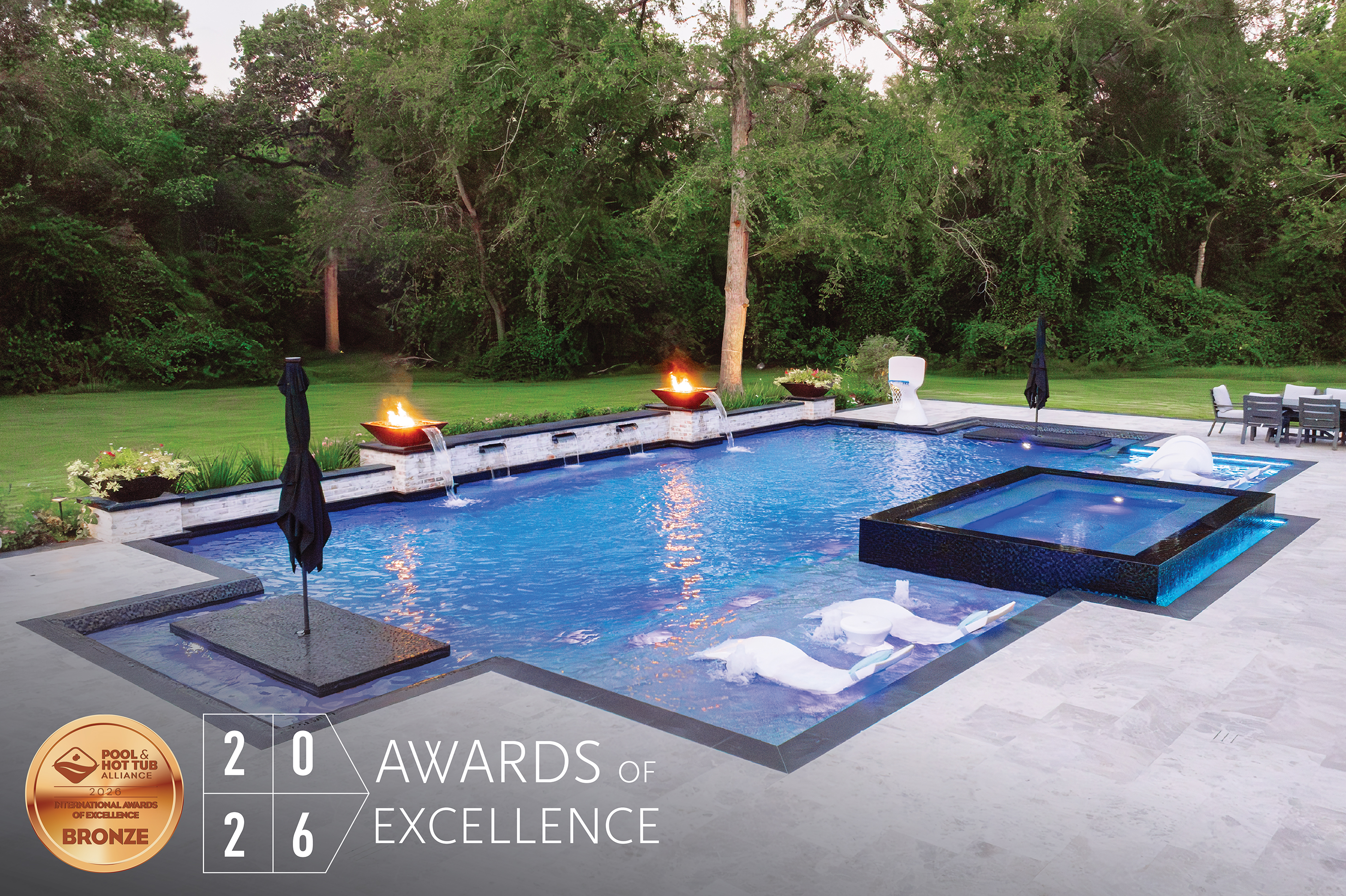 Luxury backyard pool with fire bowls, hot tub, and 2026 Awards of Excellence bronze certification badge
