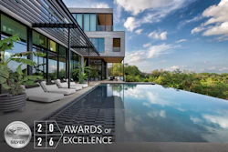 Modern luxury home with infinity pool overlooking landscape, featuring WAF 2026 Silver Award of Excellence certification