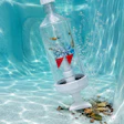 Brita water filter pitcher submerged underwater with bubbles and aquatic debris